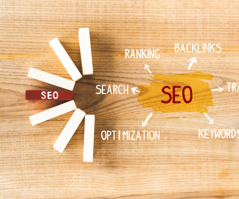 top view of wooden rectangles with lettering seo and illustratio